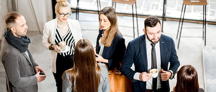 Persons talking during a networking event