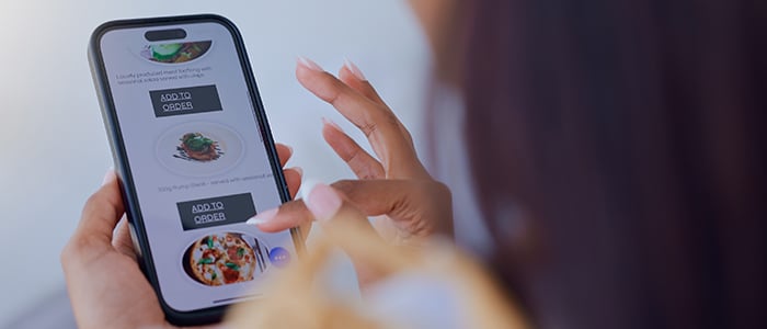 Women is ordering food on a smartphone