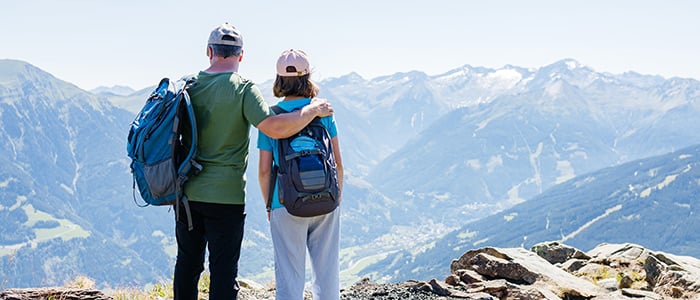Traveller looking over Swiss mountain scenery