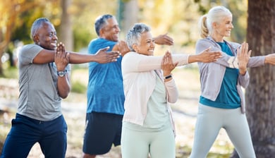A group of active seniors stretching outside