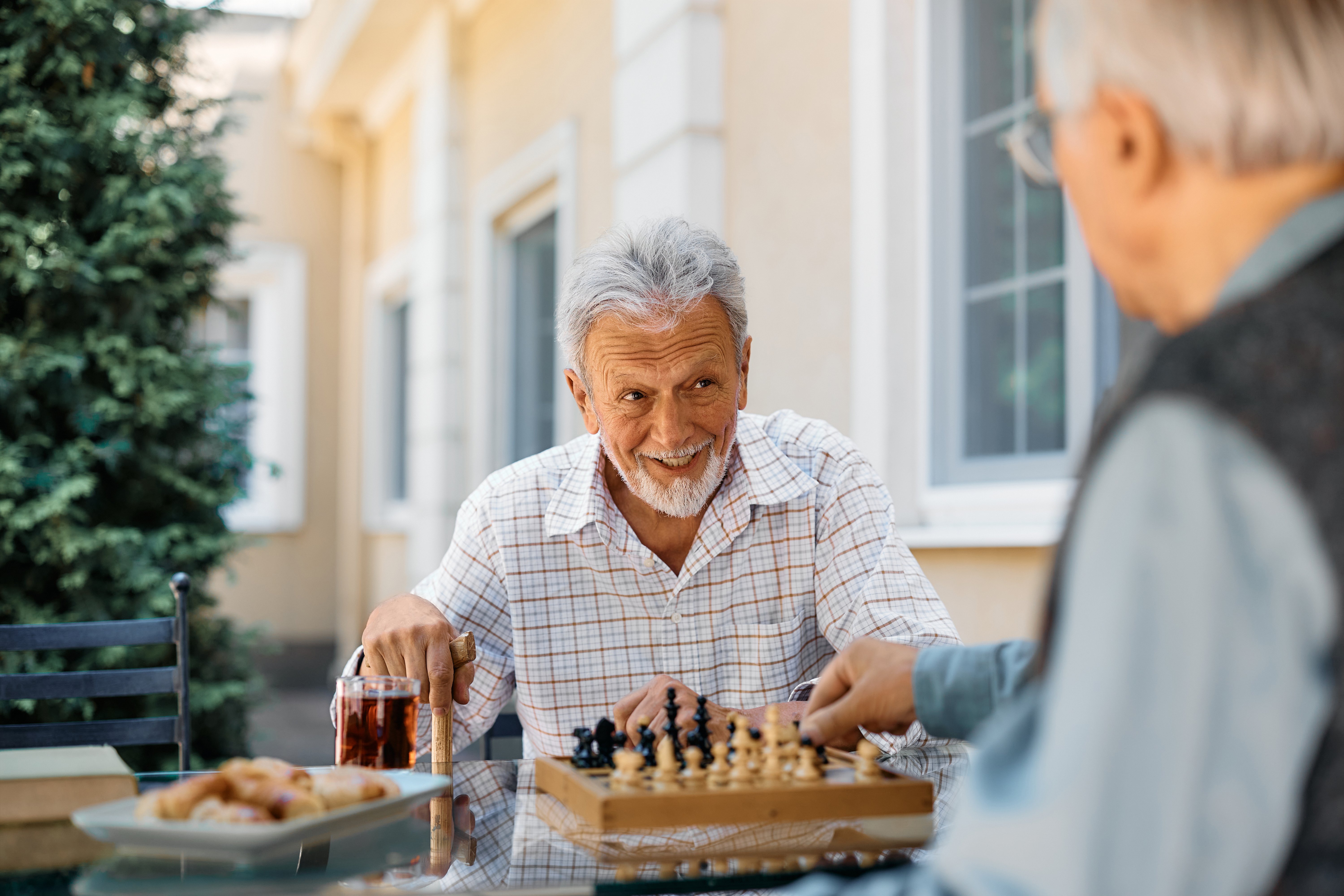Two senior men playing a game of chess