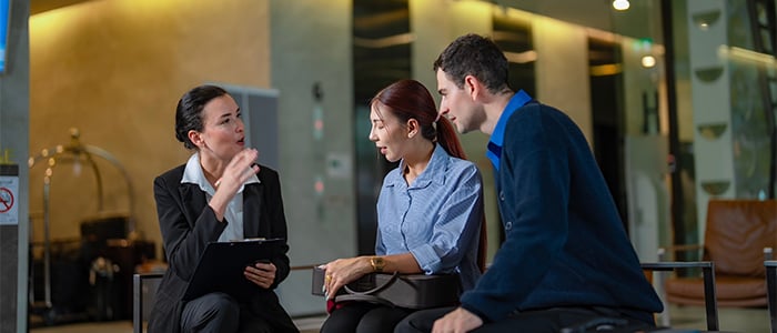 Hotel staff interacting with guests