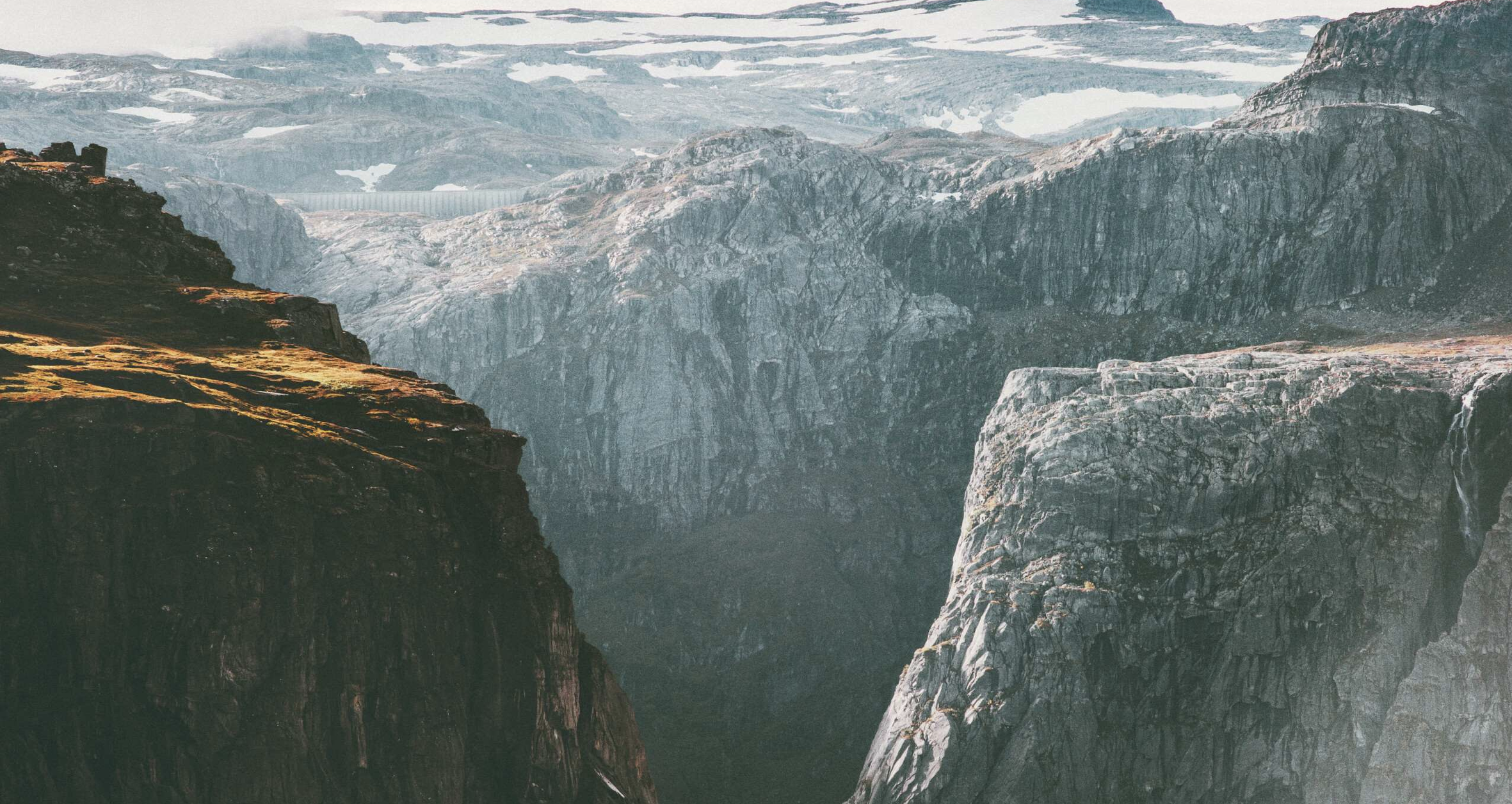 Two cliffs meeting in a mountainous setting