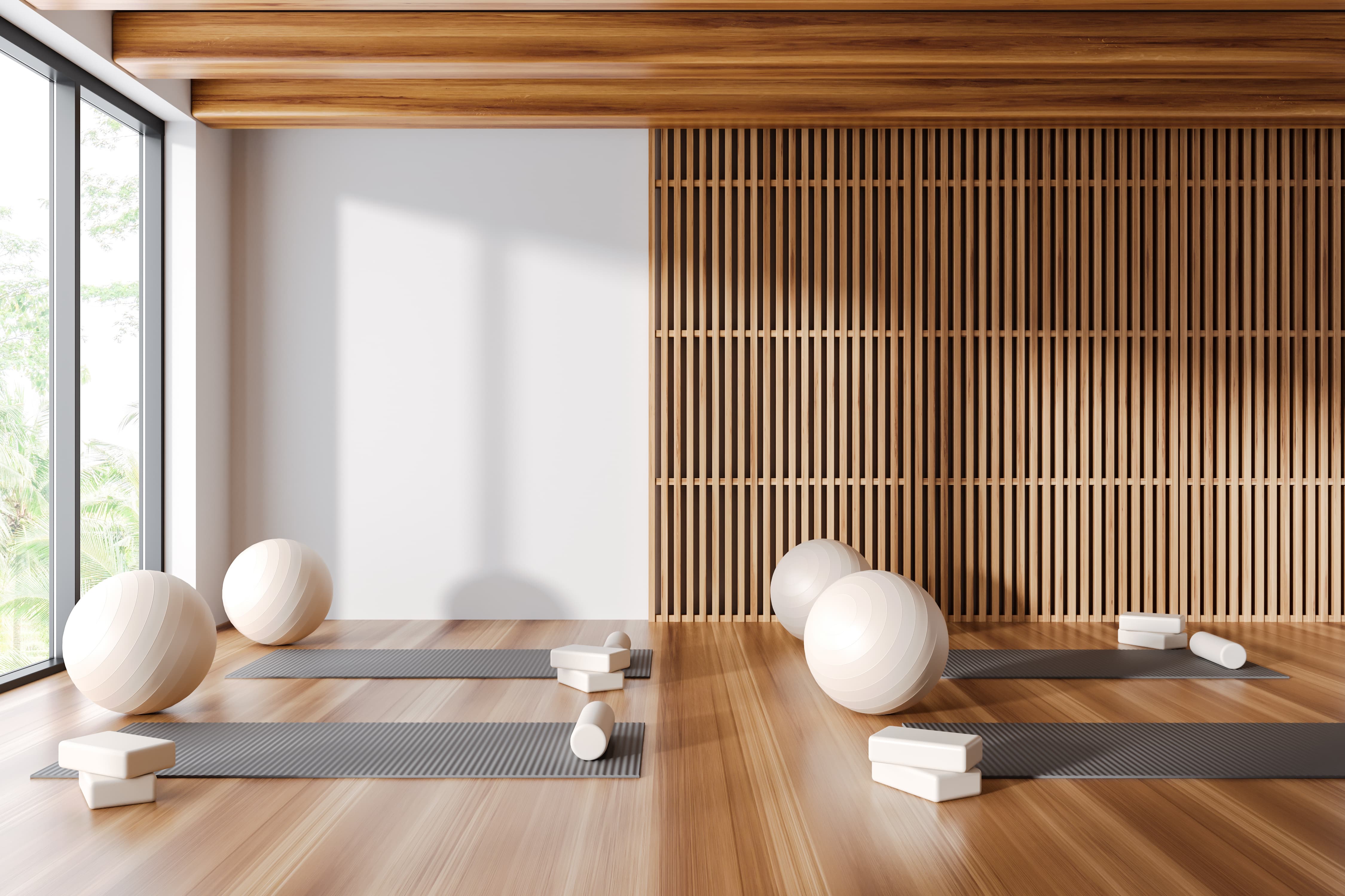 Modern aesthetic yoga studio with mats, balls and blocks set up