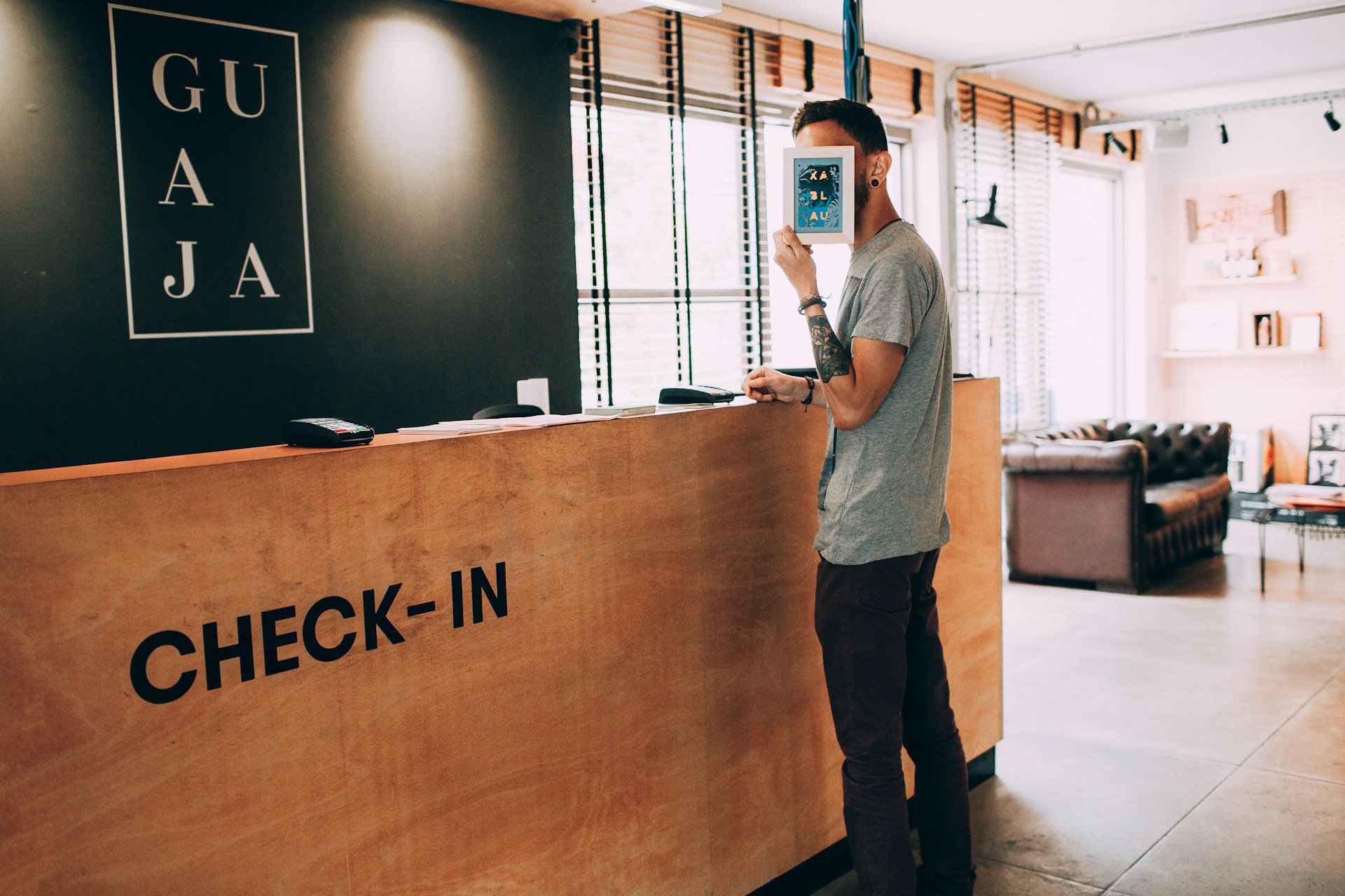Guest waiting at a hotel reception desk