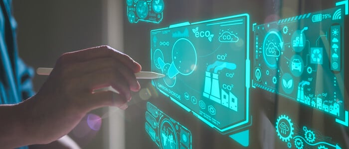 a hand with a pencil on a glass wall using a digital interface, showcasing an energy management system concept
