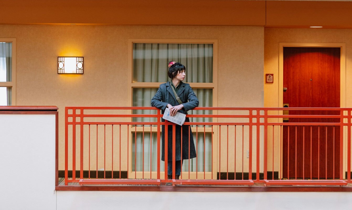 Person waiting in a hotel lobby