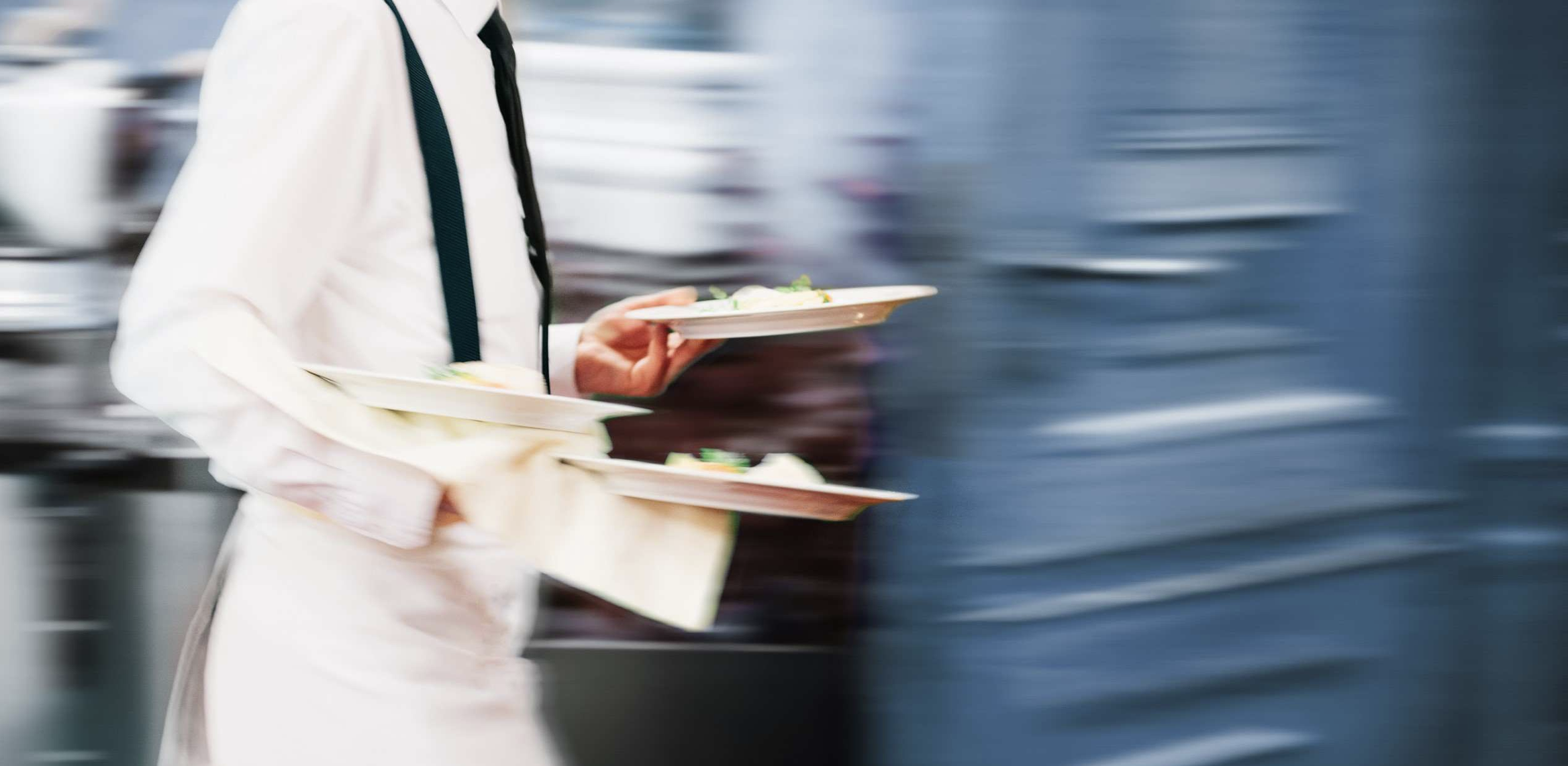 waiter carrying plates