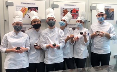 Photography of the EHL's students with lava cakes