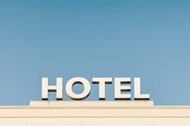 hotel sign against clear blue sky