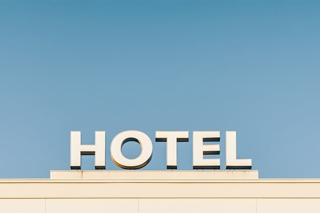 hotel sign against clear blue sky