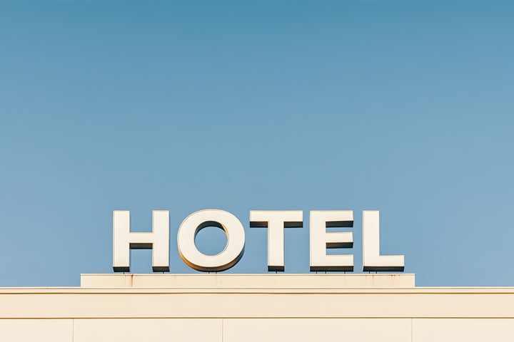 hotel sign against clear blue sky