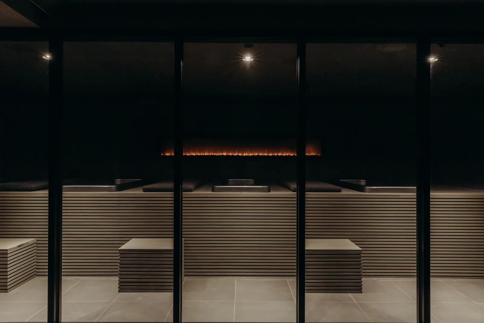 A dimly lit sauna in upmarket social wellness club