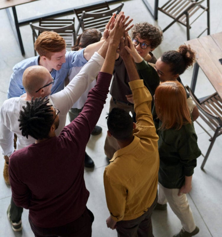 Employees high-fiving each other